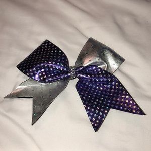I am selling a purple and silver WC twinkle bow.